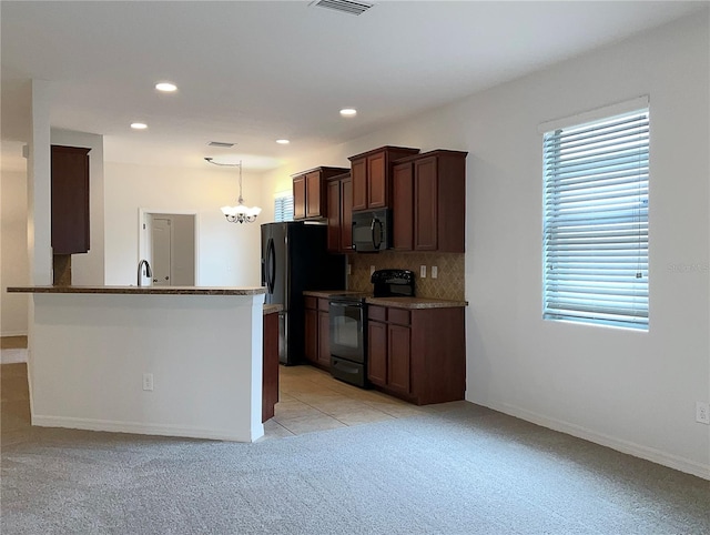 kitchen with black appliances, sink, decorative backsplash, light colored carpet, and kitchen peninsula