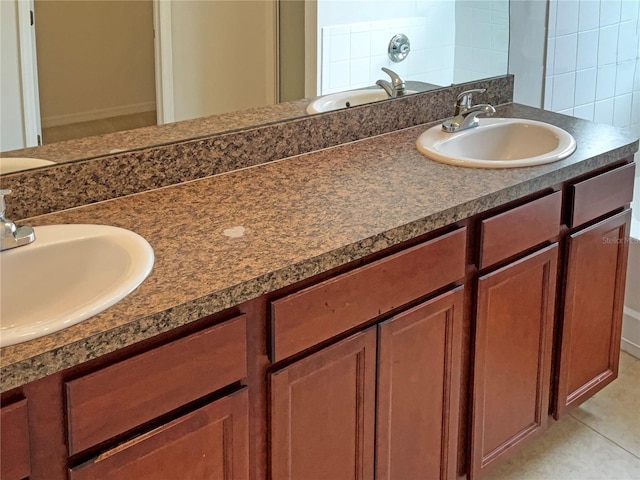 bathroom with vanity, backsplash, tile patterned floors, and a bath