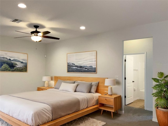 bedroom with connected bathroom, carpet floors, and ceiling fan