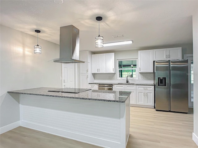 kitchen featuring pendant lighting, sink, stainless steel appliances, island range hood, and white cabinets