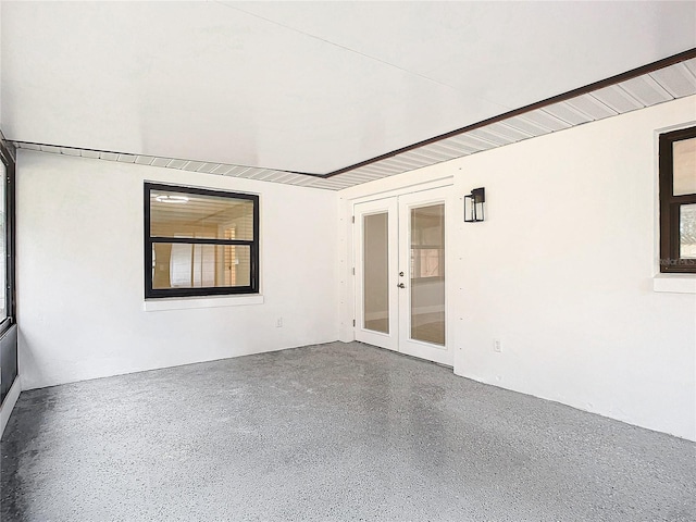 spare room featuring french doors