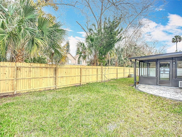 view of yard with a patio area and a sunroom