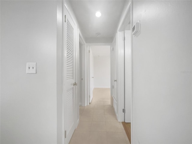 hall with light tile patterned flooring