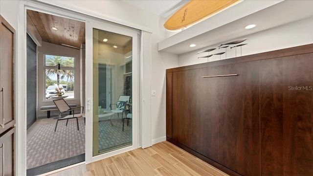 doorway to outside featuring wooden ceiling