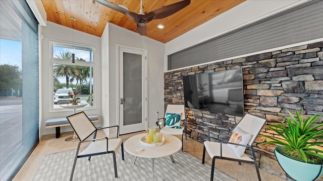 sunroom / solarium featuring lofted ceiling and wooden ceiling