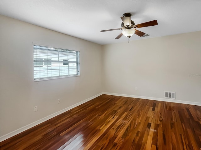 empty room with hardwood / wood-style flooring and ceiling fan