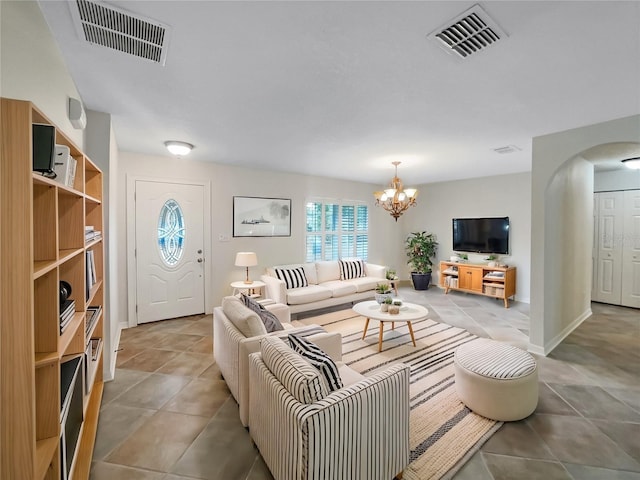 living room with an inviting chandelier