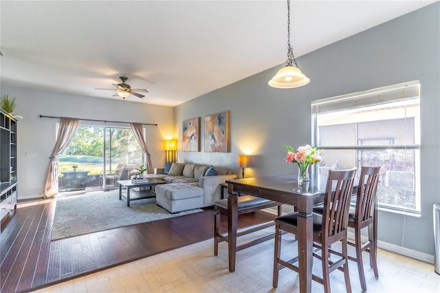 dining room with light hardwood / wood-style floors and ceiling fan