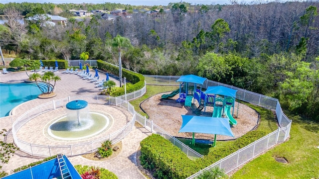 view of pool with a playground