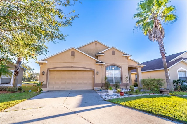 view of front of house featuring a garage and a front yard