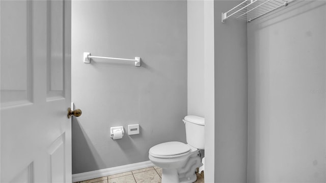 bathroom featuring tile patterned floors and toilet