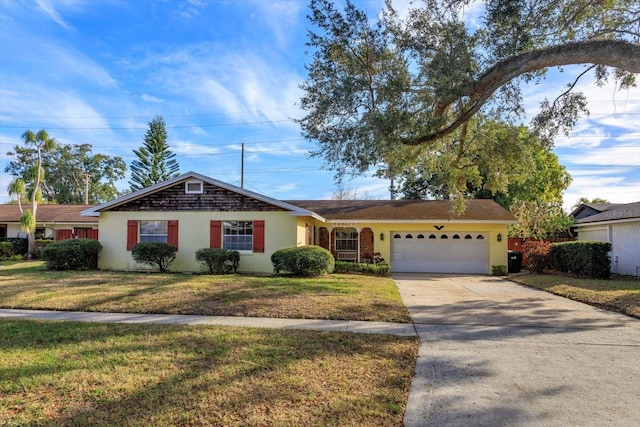 ranch-style house with a garage and a front lawn