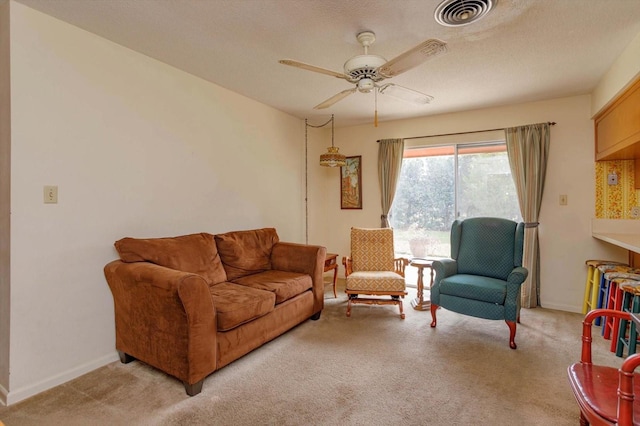 living room featuring ceiling fan and light carpet