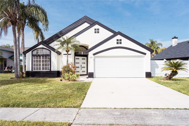 view of front of house with a garage and a front yard