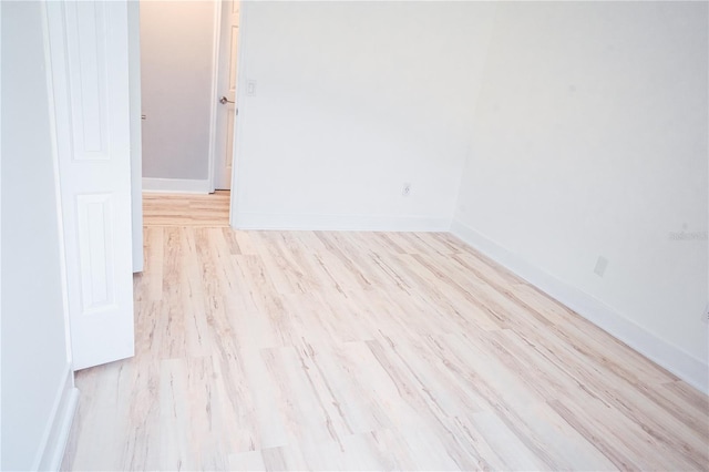 unfurnished room with light wood-type flooring