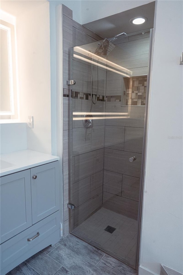 bathroom featuring a shower with shower door