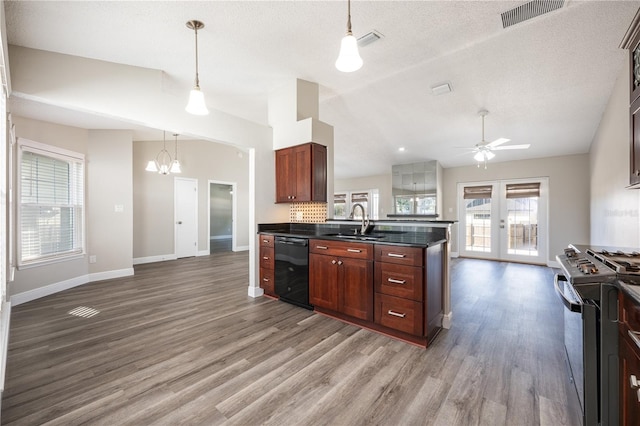 kitchen with lofted ceiling, stainless steel range oven, sink, and dishwasher