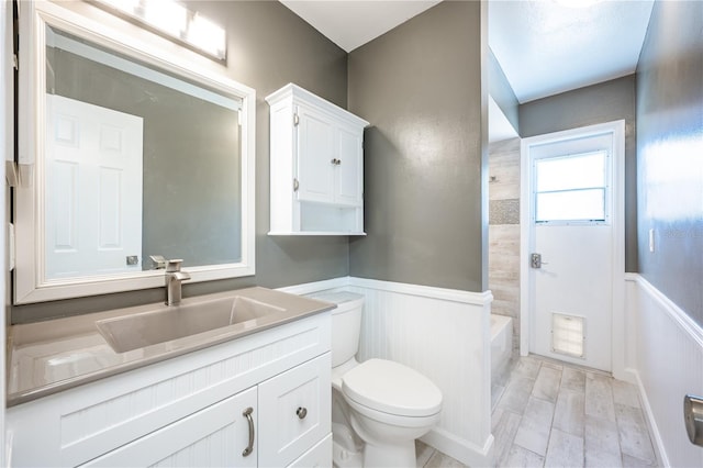 full bathroom featuring shower / washtub combination, toilet, and vanity