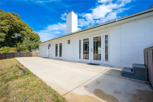 back of house featuring a patio and french doors