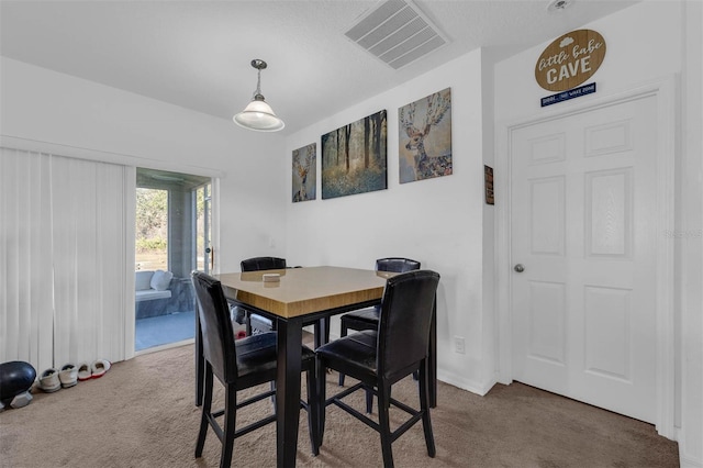 dining space with carpet