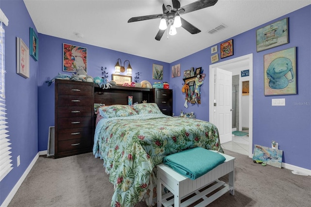 bedroom with ceiling fan and light colored carpet