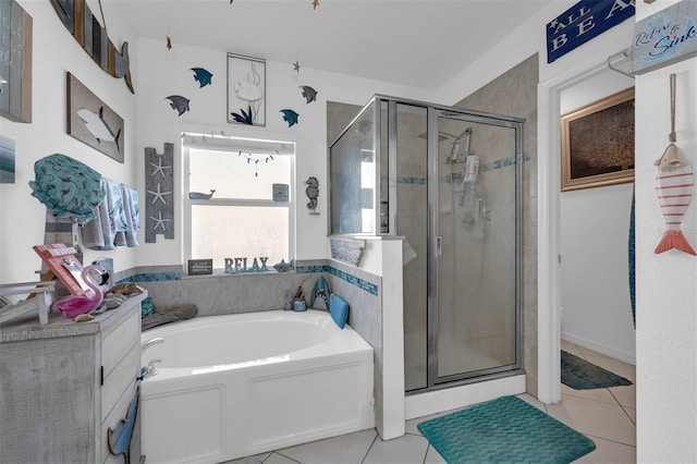 bathroom with shower with separate bathtub and tile patterned floors