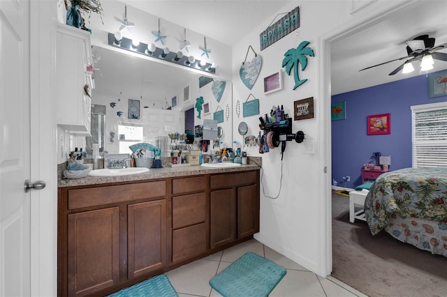 bathroom featuring tile patterned flooring, vanity, ceiling fan, and walk in shower