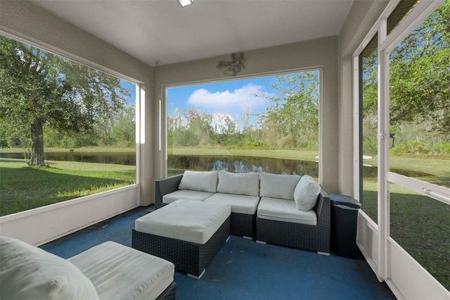 sunroom / solarium with a water view and plenty of natural light