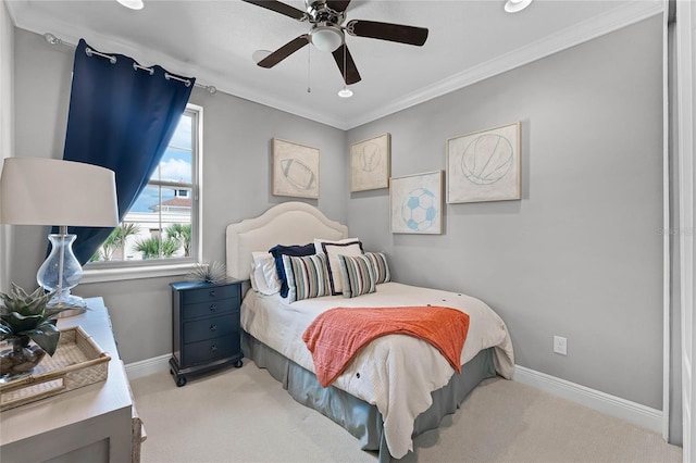 bedroom with crown molding, light colored carpet, and ceiling fan