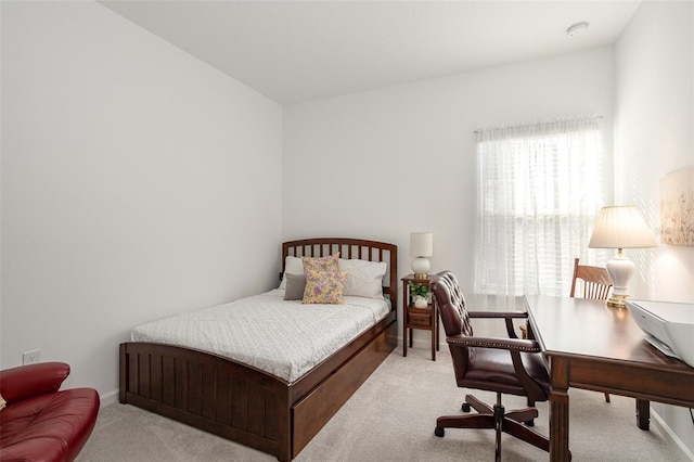 bedroom with light carpet