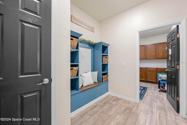 hall with light hardwood / wood-style floors