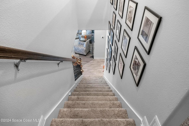 staircase featuring hardwood / wood-style flooring