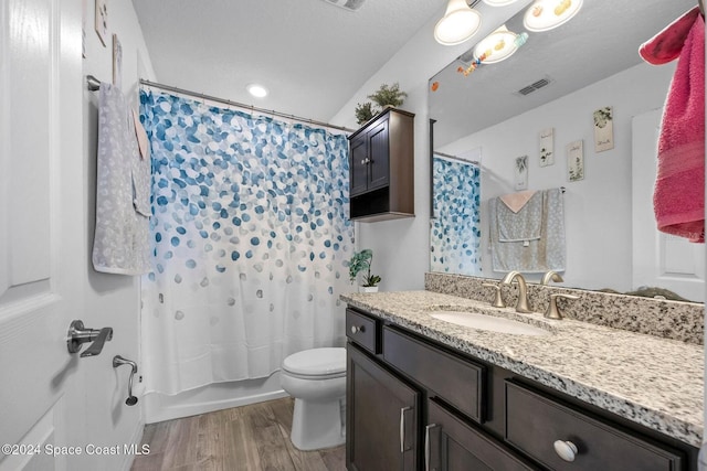 full bathroom with toilet, a textured ceiling, vanity, shower / bath combo, and hardwood / wood-style flooring