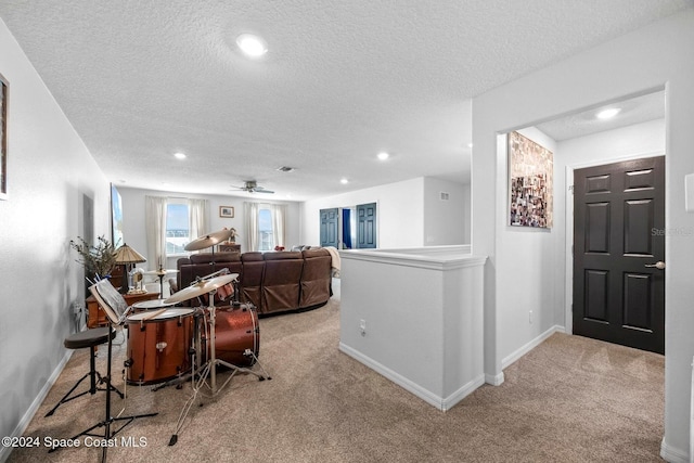 living room with light colored carpet and a textured ceiling