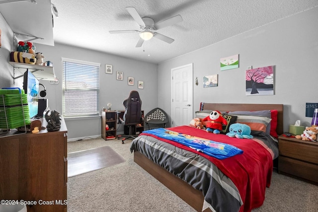 bedroom featuring a textured ceiling, ceiling fan, and carpet flooring