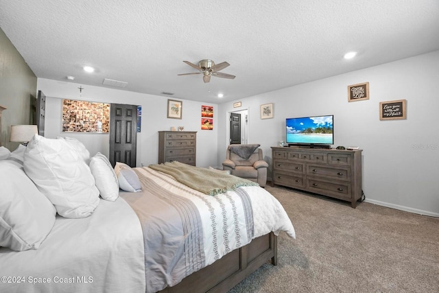 carpeted bedroom with a textured ceiling and ceiling fan