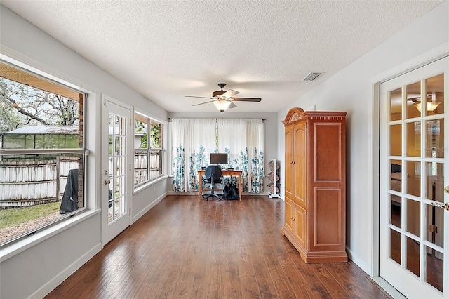 office with dark wood-type flooring, ceiling fan, and a textured ceiling