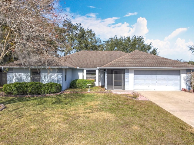 ranch-style house with a garage and a front lawn