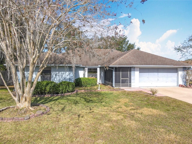 single story home featuring a garage, a front lawn, and a sunroom