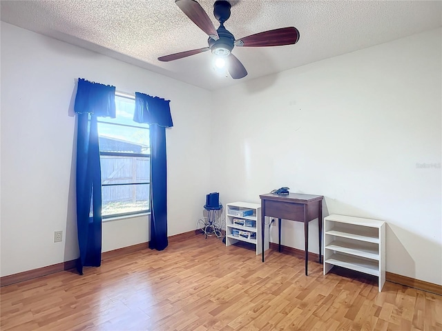 interior space featuring plenty of natural light, light hardwood / wood-style floors, and ceiling fan