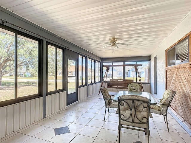 sunroom with plenty of natural light and ceiling fan