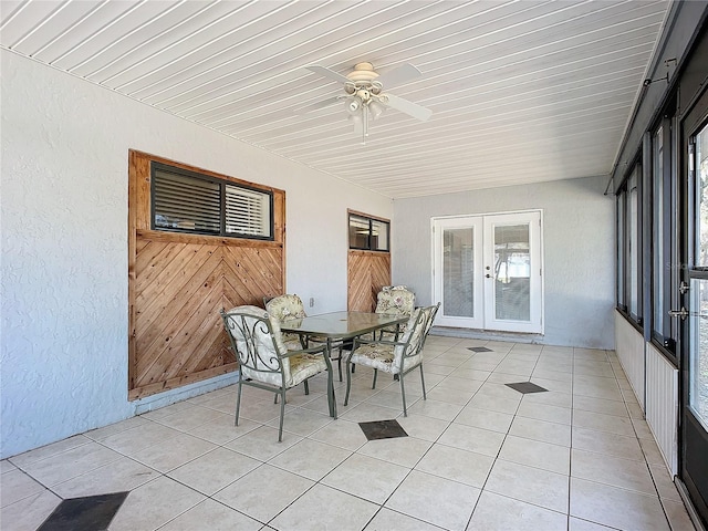 unfurnished sunroom with french doors and ceiling fan