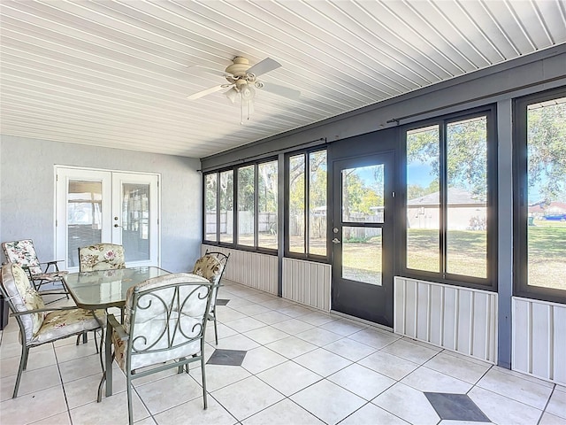 sunroom / solarium featuring french doors, ceiling fan, plenty of natural light, and wooden ceiling