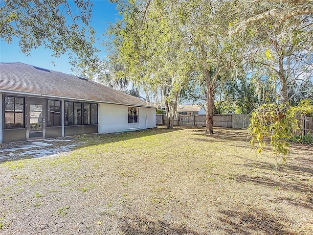 view of yard featuring a sunroom