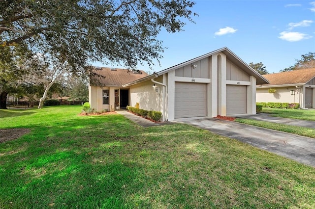 single story home featuring a garage and a front yard