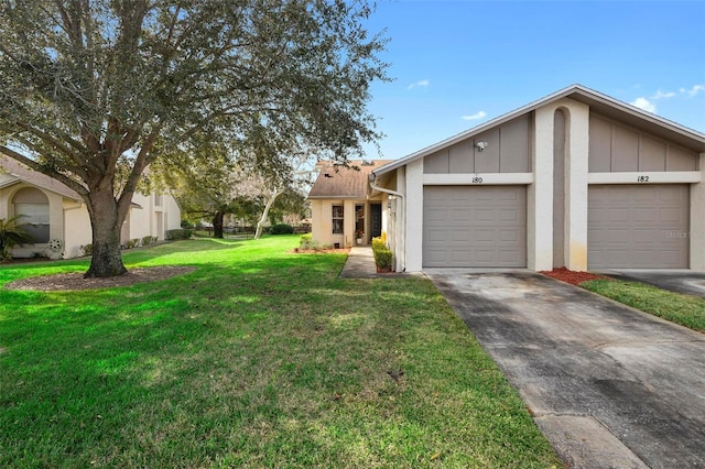 view of front of home featuring a garage and a front yard