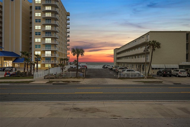 outdoor building at dusk featuring a water view