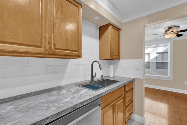 kitchen featuring tasteful backsplash, sink, ceiling fan, crown molding, and light hardwood / wood-style flooring