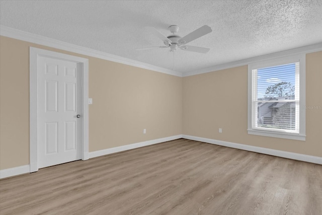 empty room featuring ceiling fan, ornamental molding, light hardwood / wood-style floors, and a textured ceiling