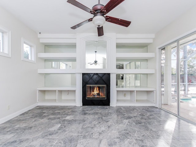 unfurnished living room featuring ceiling fan